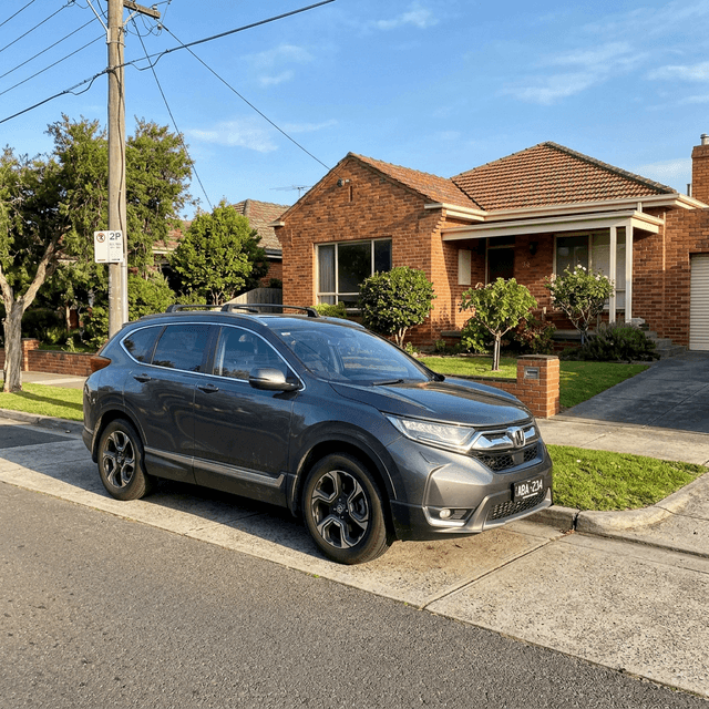 Authentic photo of Sandra W.'s 2018 Honda CR-V parked in a driveway