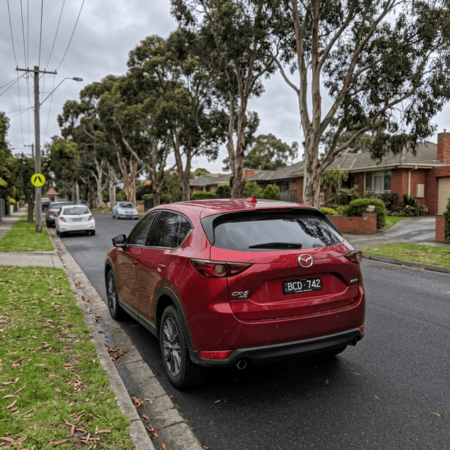 Authentic photo of Priya S.'s 2020 Mazda CX-5 parked in a driveway